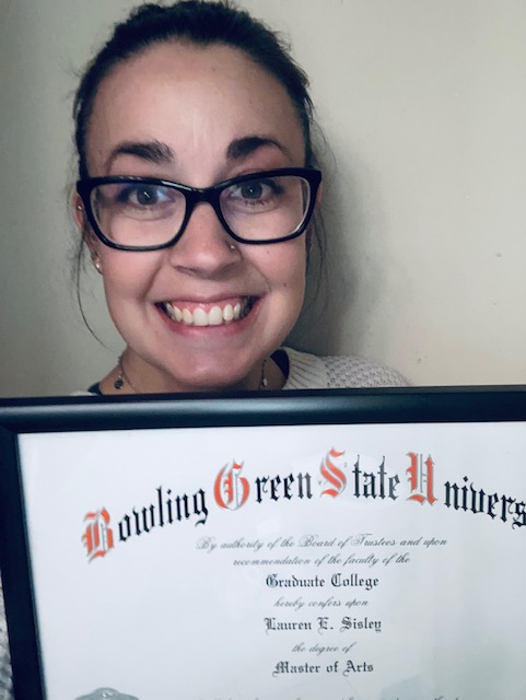 Myself holding my graduate defree from Bowling Green State University